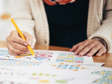 Let Richards help you build the best custom invitations for your event! Our helpful staff will help guide you through the process!
Image: A person (perhaps one of our helpful staff members) helps sort through a stack of papers, pencil in hand.